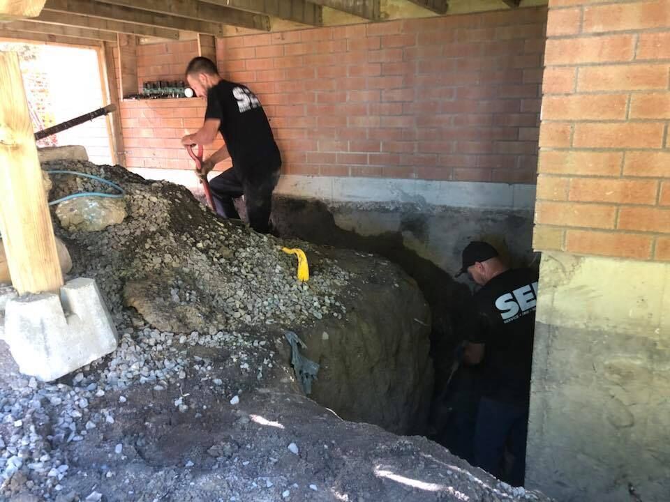 Excavation manuelle sous une structure existante